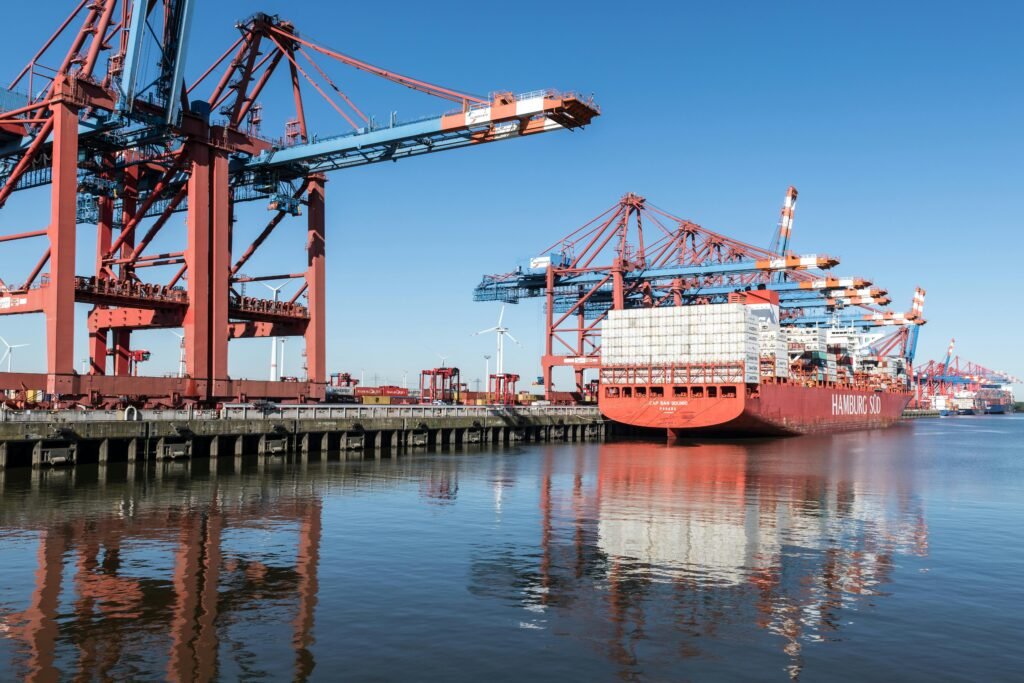 Container Ship Moored in Docks under Crane